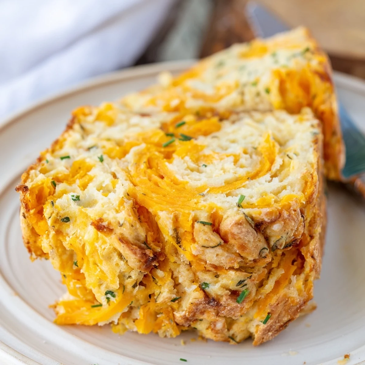 Flaky Sweet Potato Cheddar Muffin Loaf, fresh from the oven, golden and inviting.  