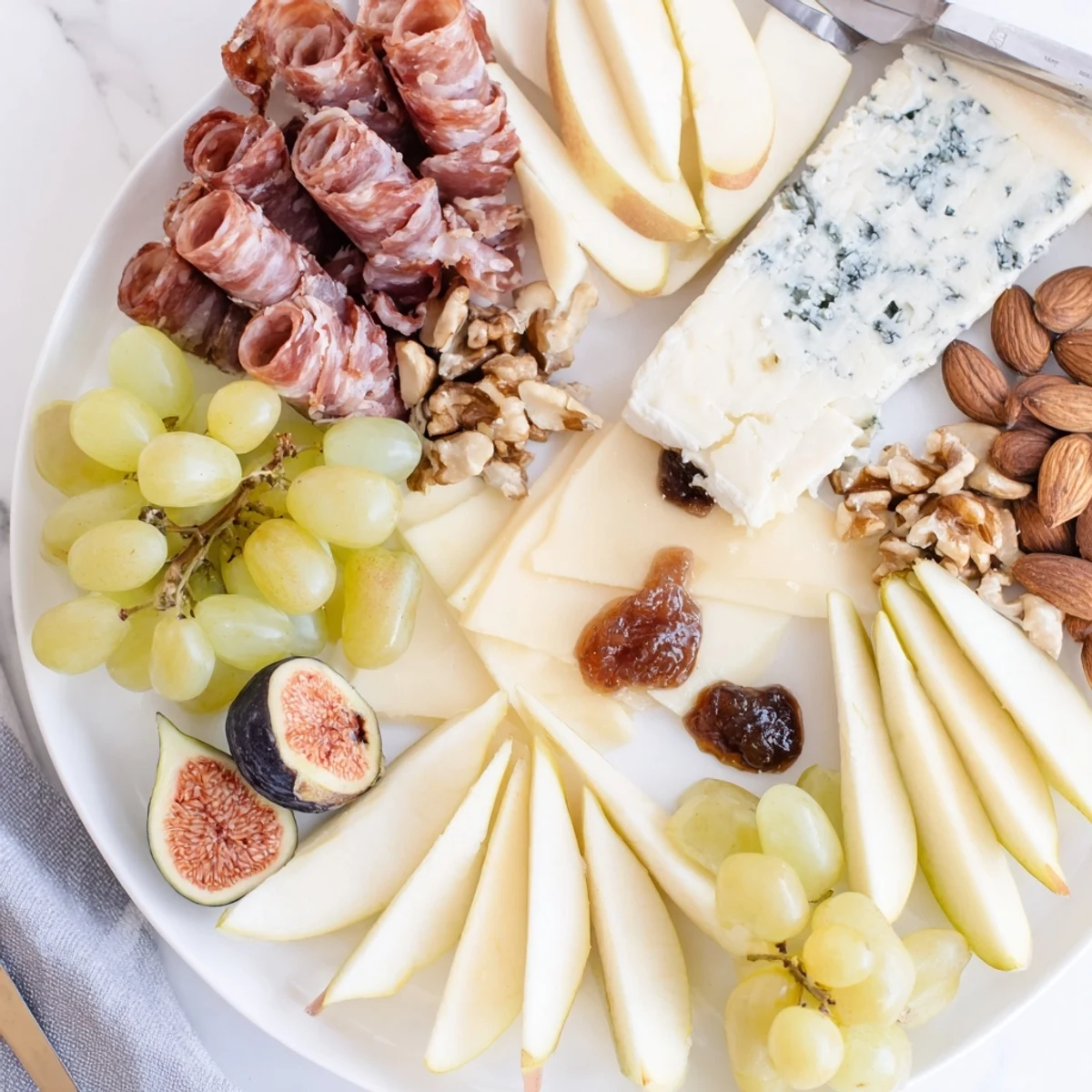 A beautiful Wine & Food Pairing Platter, filled with gourmet cheeses, meats, and fresh fruits.