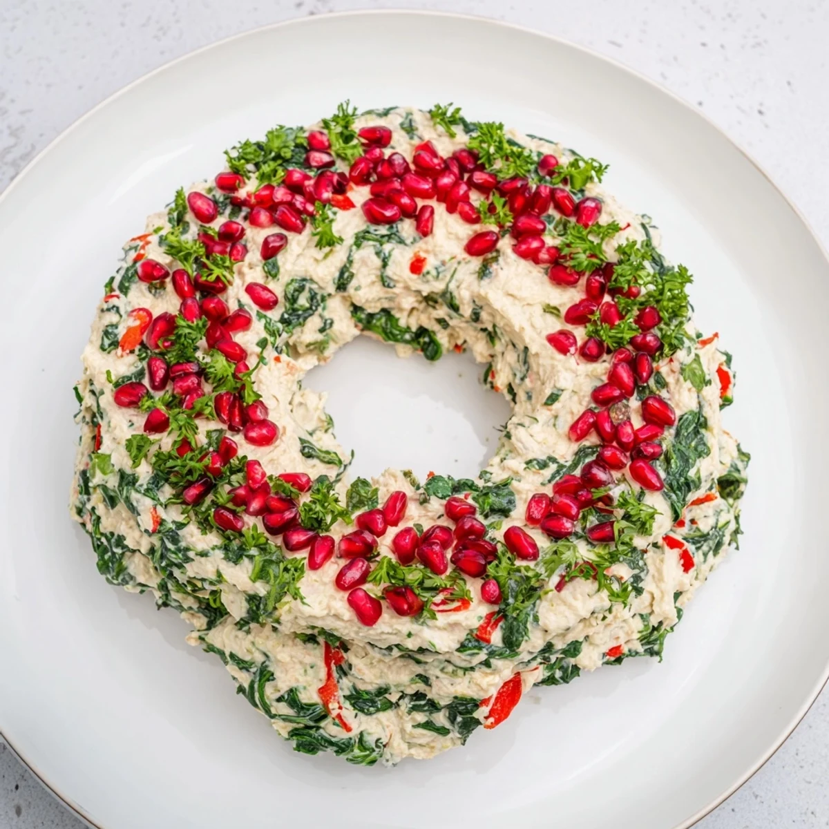 This delicious Red Pepper and Spinach Dip Wreath offers a flavorful, vegetarian appetizer, ideal for festive celebrations.