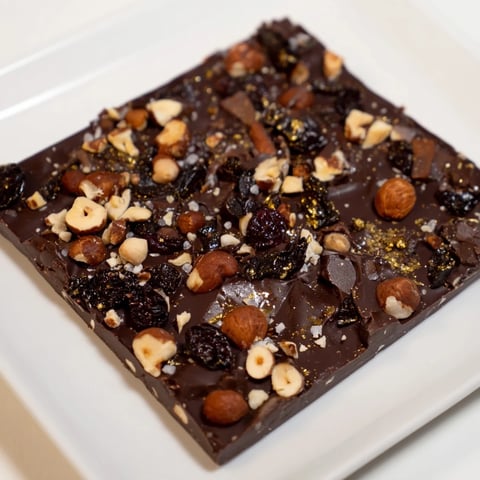 Decadent Midnight Mosaic dessert with dark figs, chocolate, and olives, a gourmet treat.