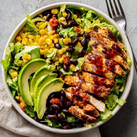 Fresh Southwest chicken salad bowl with zesty salsa-lime dressing, perfect for lunch.