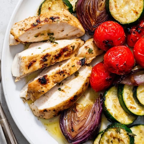 Sheet Pan Chicken &amp; Veggies recipe: Colorful, flavorful vegetables roasted alongside tender chicken.
