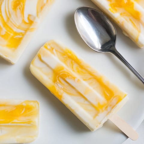 Refreshing Citrus Yogurt Popsicles recipe: frozen treat with bright citrus flavors, perfect for summer.