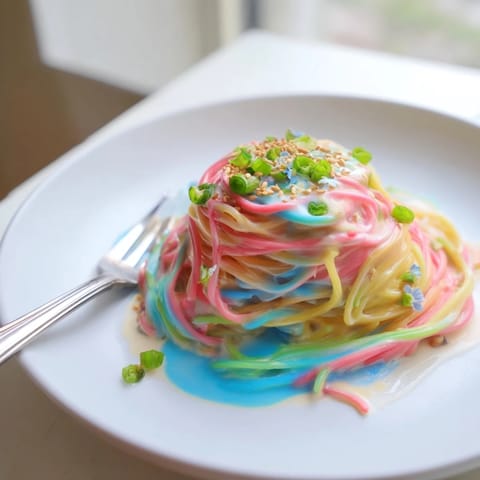 A whimsical Neon Noodle Cloud recipe featuring colorful pasta in creamy, dreamy sauce.  