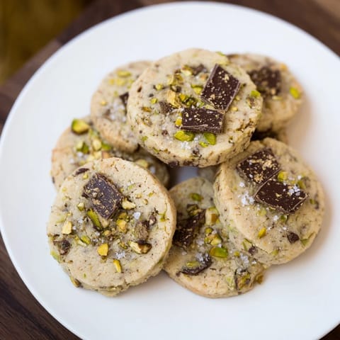 Imagine the texture: A delicious bite of buttery salted pistachio chocolate chunk shortbread cookies, perfect with coffee.