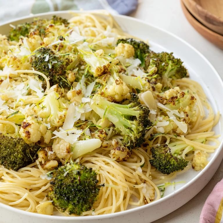 Savory angel hair pasta with roasted garlic lemon broccoli, ready to enjoy for a delicious dinner.