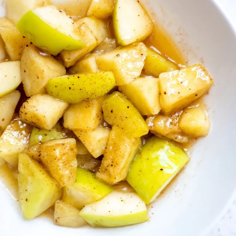 Sweet and simple Slow Cooker Stewed Apples; a beautifully textured dessert, ready to be enjoyed.