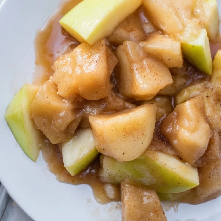Warm and comforting: A generous bowl of delicious Slow Cooker Stewed Apples, perfect for breakfast.